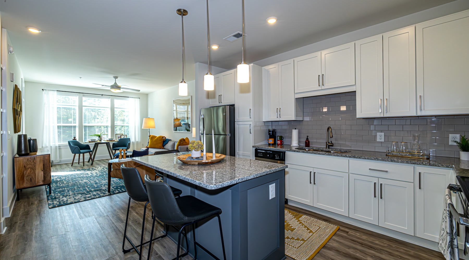 a kitchen with white cabinets