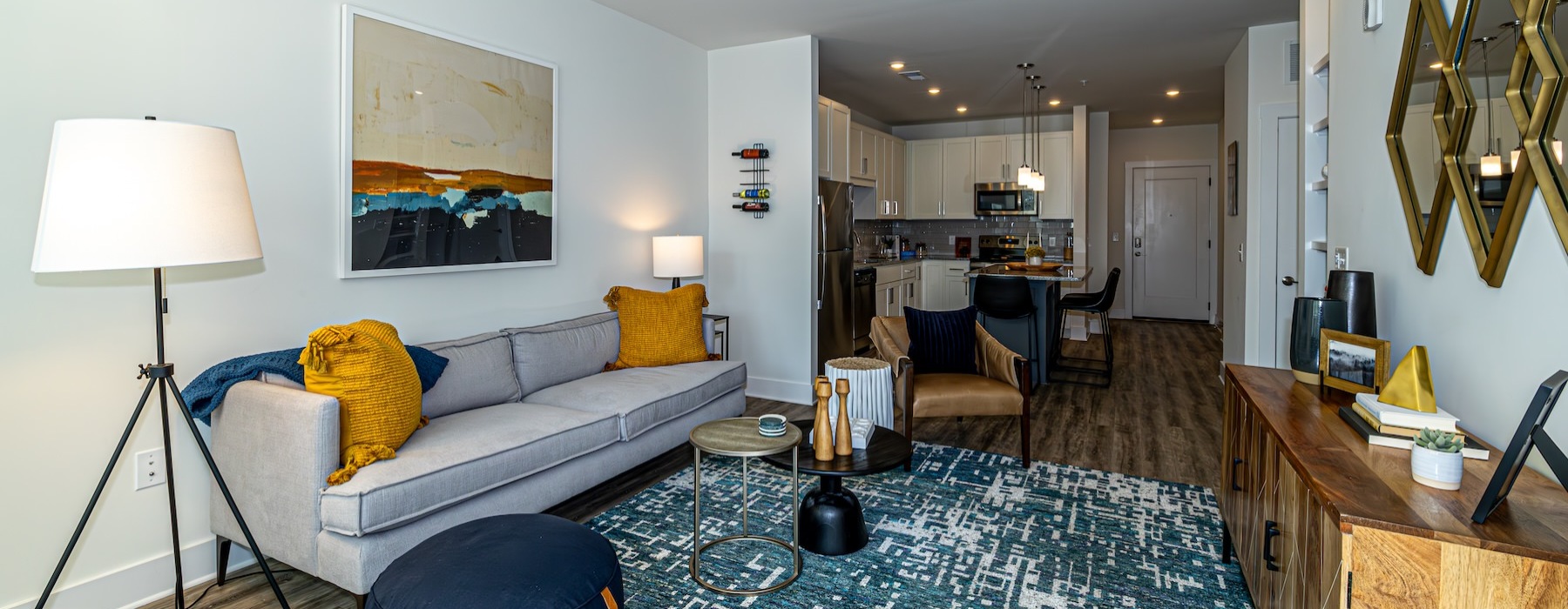 a living room with a couch and a fan
