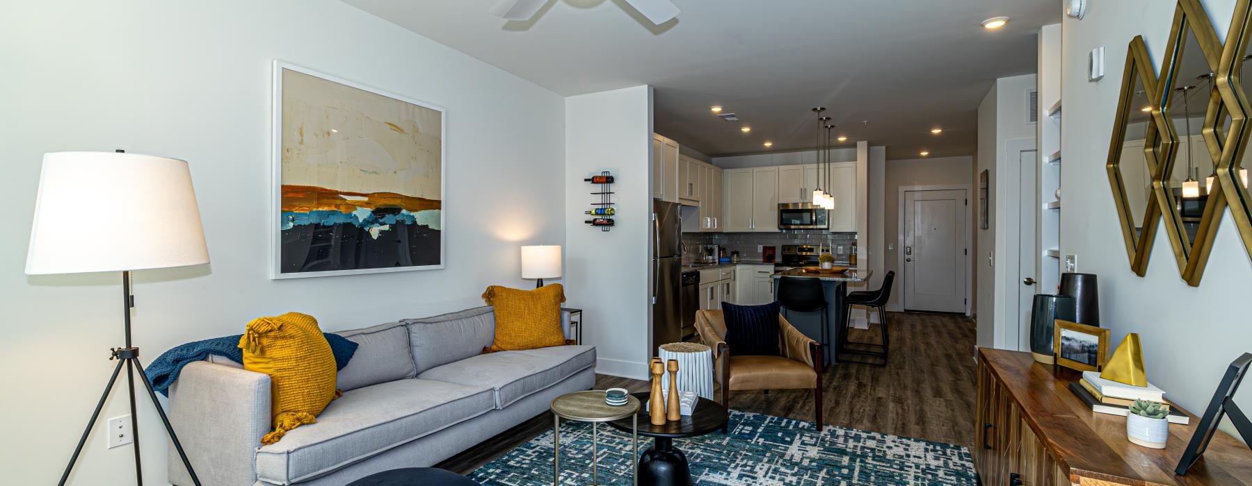 a living room with a couch and a fan